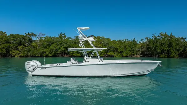 Center console at anchor by the mangroves